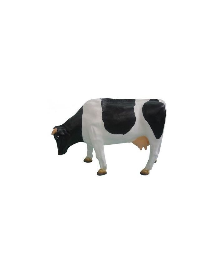 DUŻA KROWA PASĄCA SIĘ